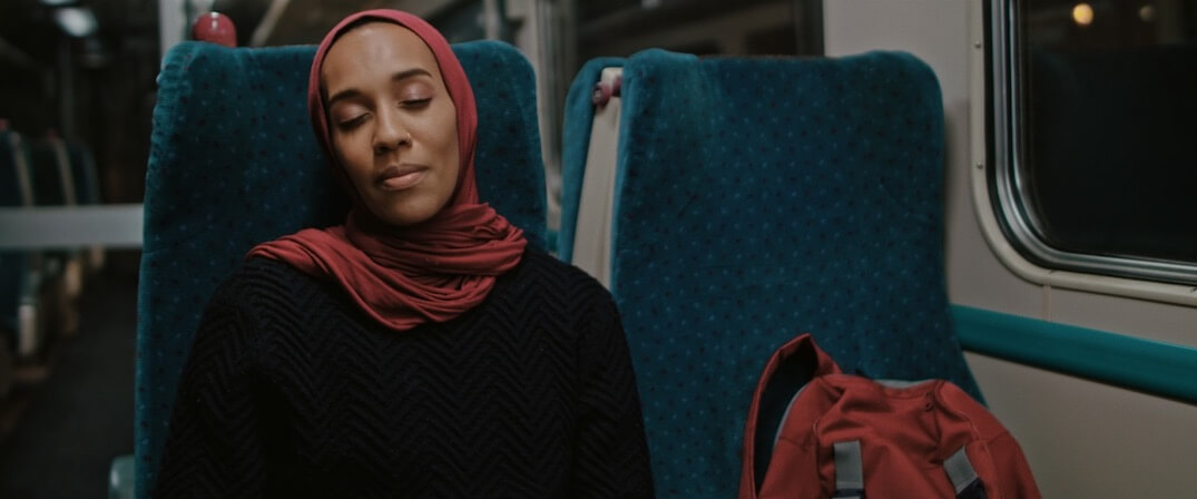 Image of Asma Elbadawi Sat on train seat